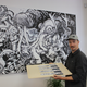 Forest Stearns with his artwork and etchings.